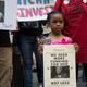 Activists rally for affordable housing and against U.S. Secretary of Housing and Urban Development Ben Carson during his appearance at the New York Stock Exchange (NYSE) to ring the closing bell, June 12, 2017 in New York City.